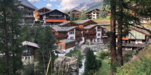 village trees river cabin woods day time