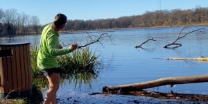 autumn fall forest lady lake people river woman skipping rocks water