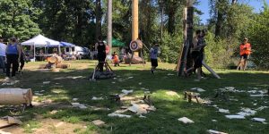 Lumberjack Competitors grass target tent tree wood