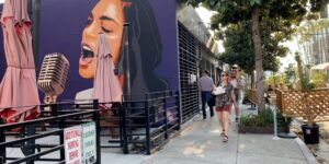 outdoor cafe urban mural billie holiday street traffic bench