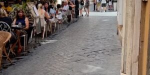 tourist walking crowd people daytime dining eating food
