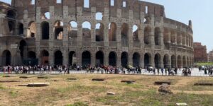 tourist walking town crowd people rome colosseum