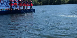 water skiing woman daytime ocean trees broll 2