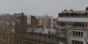 Winter City building falling gray Sky snow